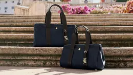 マイケル・コース　デニム素材の日本限定ハンドバッグ「ロミー」