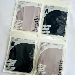 3COINS 綿混あったかレッグウォーマーと綿混腹巻付きあったかパンツのパッケージ商品写真。チャコールグレーとグレイベージュの2色。